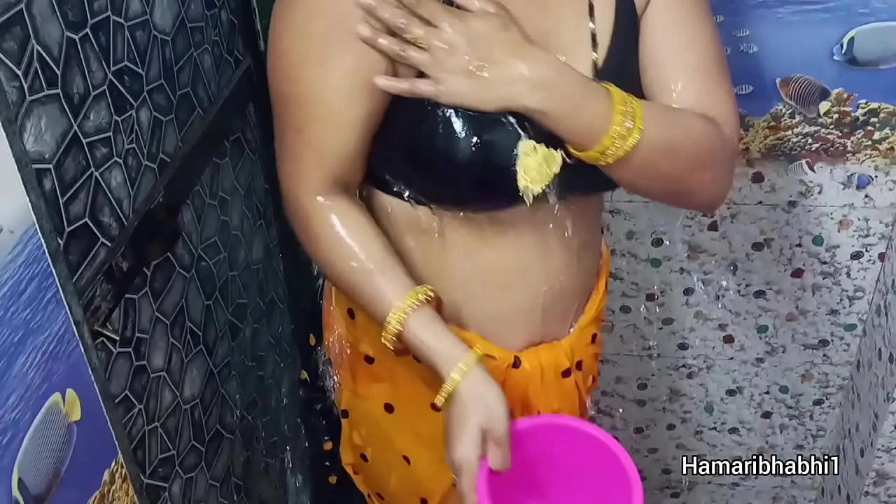 Indian Desi Bhabhi Bathing And Removing Her sexy saree