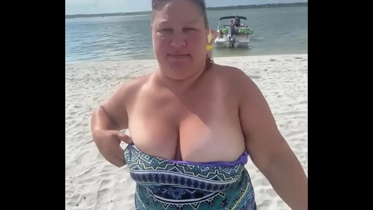 Slutty Bbw duca wife flashes her big tits on a public beach